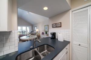 a kitchen with a sink and a counter top at 1304 Pelican Watch Villa in Seabrook Island