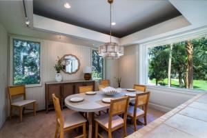a dining room with a table and chairs at 2710 Gnarled Pine in Seabrook Island
