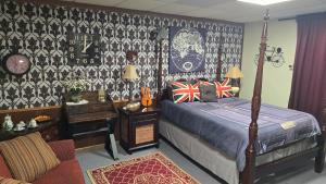 a bedroom with a bed and a desk and a bed sidx sidx sidx at Medley Manor in East Peoria