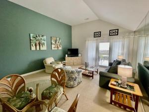a living room with a couch and a table at 1340 Pelican Watch Villa in Seabrook Island