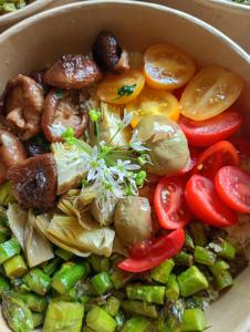 a bowl of food with vegetables in it at Le colline in corso Bra in Alba