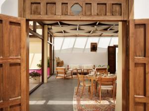 a dining room with a table and chairs at Hotel Los Patios - Parque Natural in Rodalquilar +30 photos