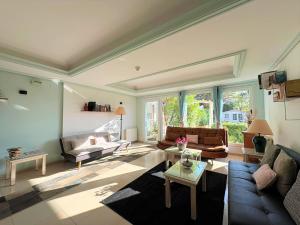 a living room with a couch and a table at Hotel Pineda Playa in Noja
