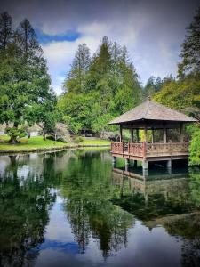 a gazebo sitting on top of a lake at Ravenwood Stay With Ocean View in Victoria