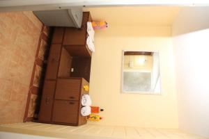 a bathroom with a door and a window at sunshine retreat in Coonoor