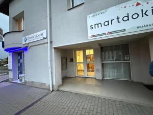 a building with a sign on the front of it at Z Apartman in Nyíregyháza
