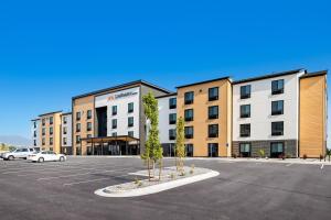 a parking lot in front of a large building at LivAway Suite Tucson in Tucson