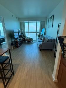 a living room with a couch and a large window at Luxury II in Fort Myers