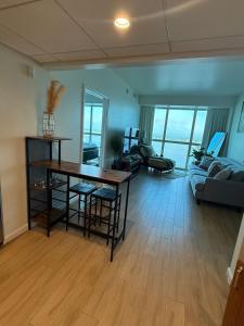 a living room with a table and a couch at Luxury II in Fort Myers