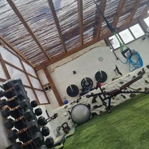 an overhead view of a room with a gym with equipment at Casa Cueva in La Oliva