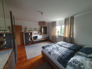 a bedroom with a bed and a large window at White House in Gronów +9 photos