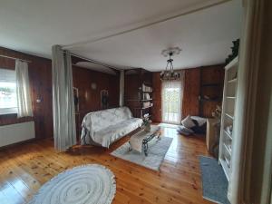 a living room with a couch and a table at White House in Gronów