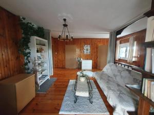 a living room with a couch and a table at White House in Gronów