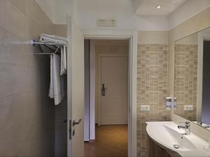 a bathroom with a sink and a mirror at Porto Di Claudio in Fiumicino +57 photos