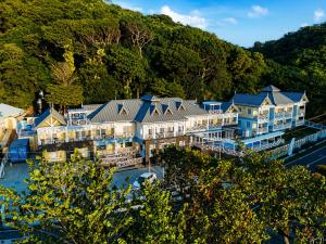 an aerial view of a resort with a mountain at Manta Lodge and Dive Centre in Speyside