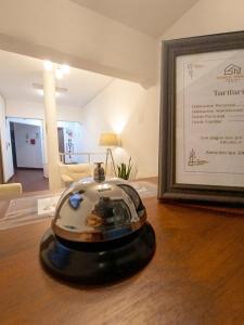 a toy train sitting on a table next to a picture at SANCA HOUSE Hostel in Trujillo +37 photos