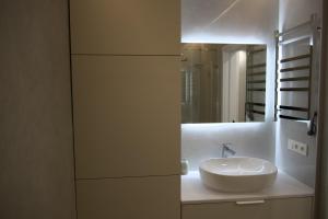 a bathroom with a sink and a mirror at СічSich in Kolomiya