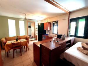 a room with a kitchen and a dining room at Psalidi beach house in Psalidi