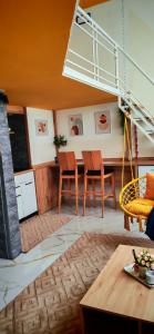 a living room with a table and chairs at Apartman - Jacuzzi Spa - Tvrđava Travnik in Travnik