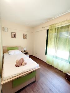 a bedroom with a bed with a towel on it at Psalidi beach house in Psalidi +46 photos