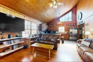 a living room with a couch and a table at Coos Moose in Ellijay