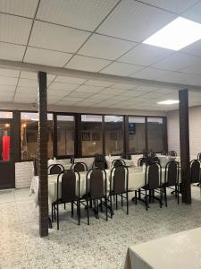 a room with a long table with chairs in it at Ak-Kalpak in Cholpon-Ata +24 photos