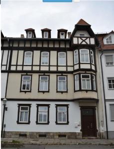 a large white building with white windows and a door at Monterunterkunft Revant WE 2 in Arnstadt