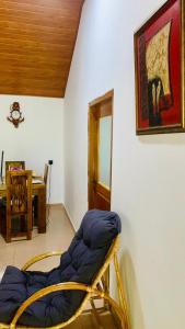 a room with a chair in the corner of a room at Mayon villa in Midigama East