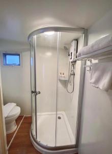 a shower stall in a bathroom with a toilet at SOL Glamping at Khao yai in Ban Nong Makha +195 photos