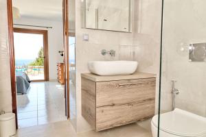 a bathroom with a sink and a toilet and a shower at 180 View Private 2 Bedroom Seaview Home in Samos +51 photos