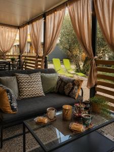 a living room with a couch and a table at SevenSeasCove in Sukošan