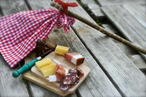 a plate of food on a picnic table at Landhäuschen in Kirchbach +18 photos