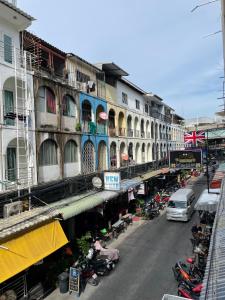 a city street with motorcycles parked next to buildings at ON'S Place in Pattaya