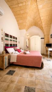 a bedroom with a large bed in a room at La Luna In Cortile in Lecce