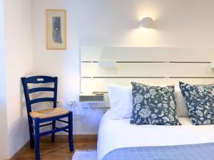 a bedroom with a bed and a chair and a desk at Luxury holiday home near Lake Bled & the Alps in Kropa