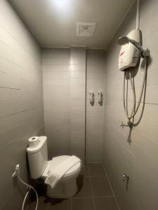 a bathroom with a toilet and a shower at ON'S Place in Pattaya +16 photos