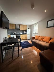 a living room with a couch and a table at Stonebarn New in Halton