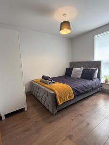 a bedroom with a large bed in a room at Stonebarn New in Halton +15 photos
