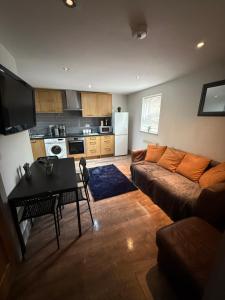 a living room with a couch and a table at Stonebarn New in Halton