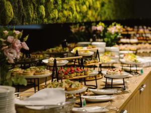 a buffet with many plates of food on a table at ibis Styles Bialystok in Białystok