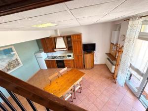 an overhead view of a kitchen with a wooden table at Agriturismo Nani in Altavilla Monferrato +25 photos