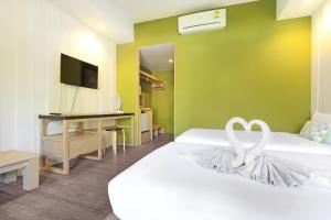 TV a/nebo společenská místnost v ubytování Samed Hideaway Resort