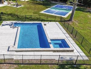 an overhead view of a swimming pool in a yard at The Clermont at Clermont Bay in Clermont Harbor