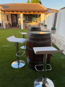 a barrel sitting on the grass in a yard at La Casita del Tejar in Cardiel de los Montes +42 photos