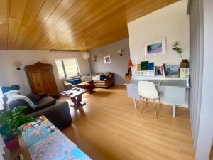 a living room with a couch and a table at Sudavik guesthouse in Súðavík