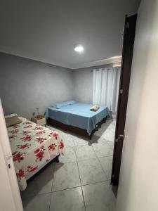 a bedroom with two beds in a room at Premium Feira ap 01 - Ar - Feiraguay - 24H check-in in Feira de Santana