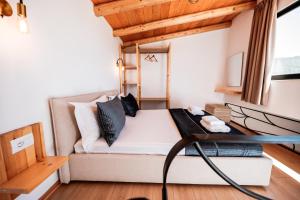 a small living room with a couch and a table at Vila Milo in Himare