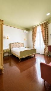 a bedroom with a bed and a large window at ISOLA - Smart Accomodation in Messina +43 photos