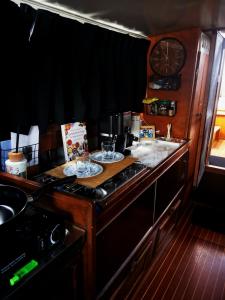 a kitchen with a counter with two dishes on it at Eco Yacht Charters in Almere