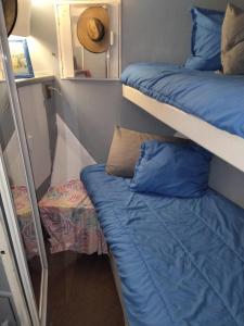 a room with two bunk beds and a mirror at party like a local in Key West +46 photos
